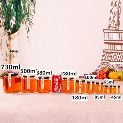 Hexagon Clear Glass Storage Bottle 100ml 500ml With Metal Lid For Honey Cream